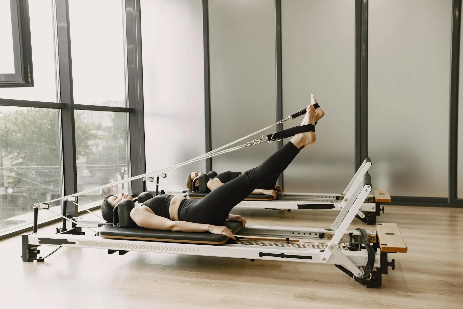 Pilates studio owner managing class bookings and payments without Mindbody using modern scheduling software