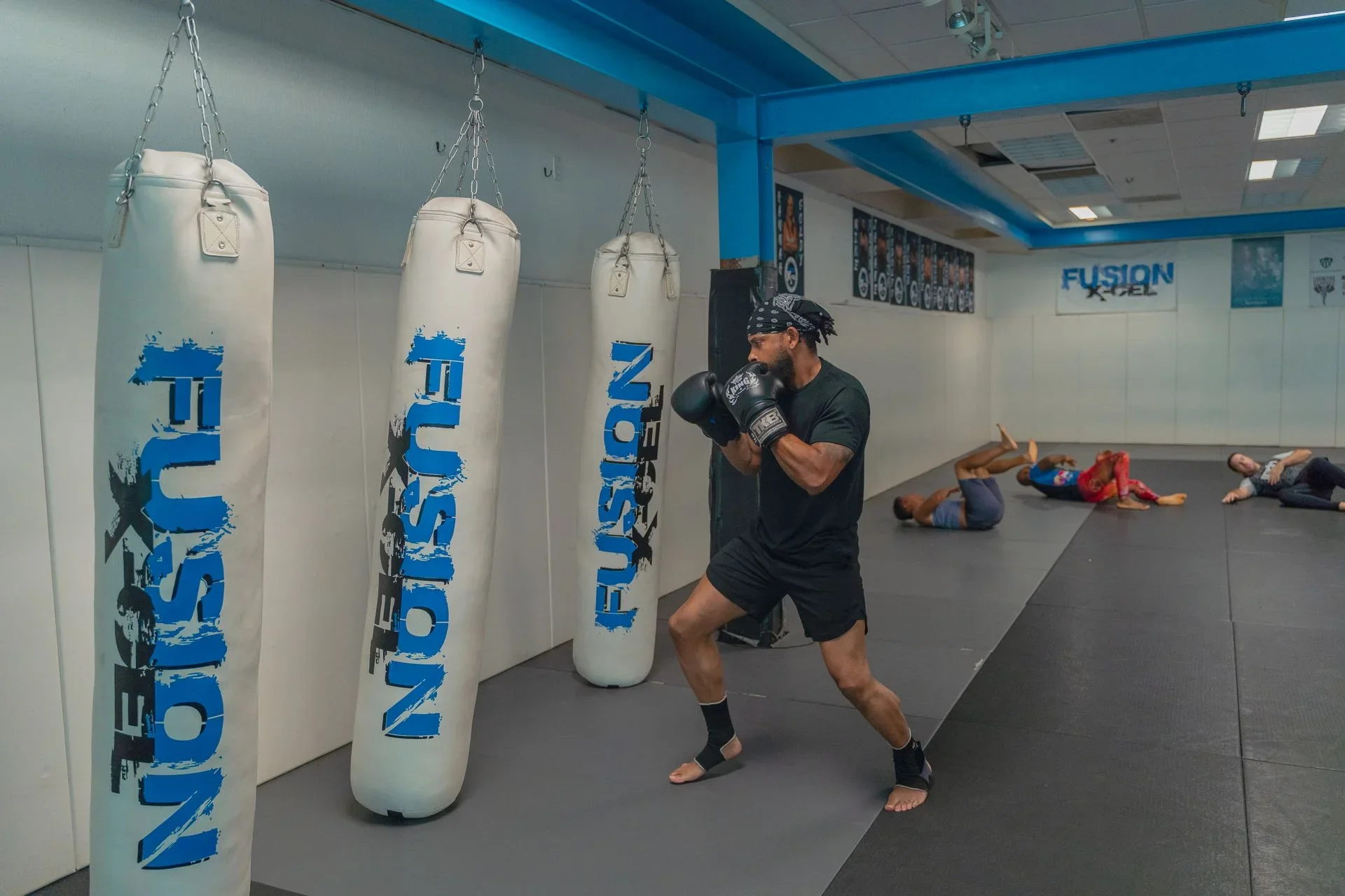 Martial arts class with students training together and an instructor leading the session