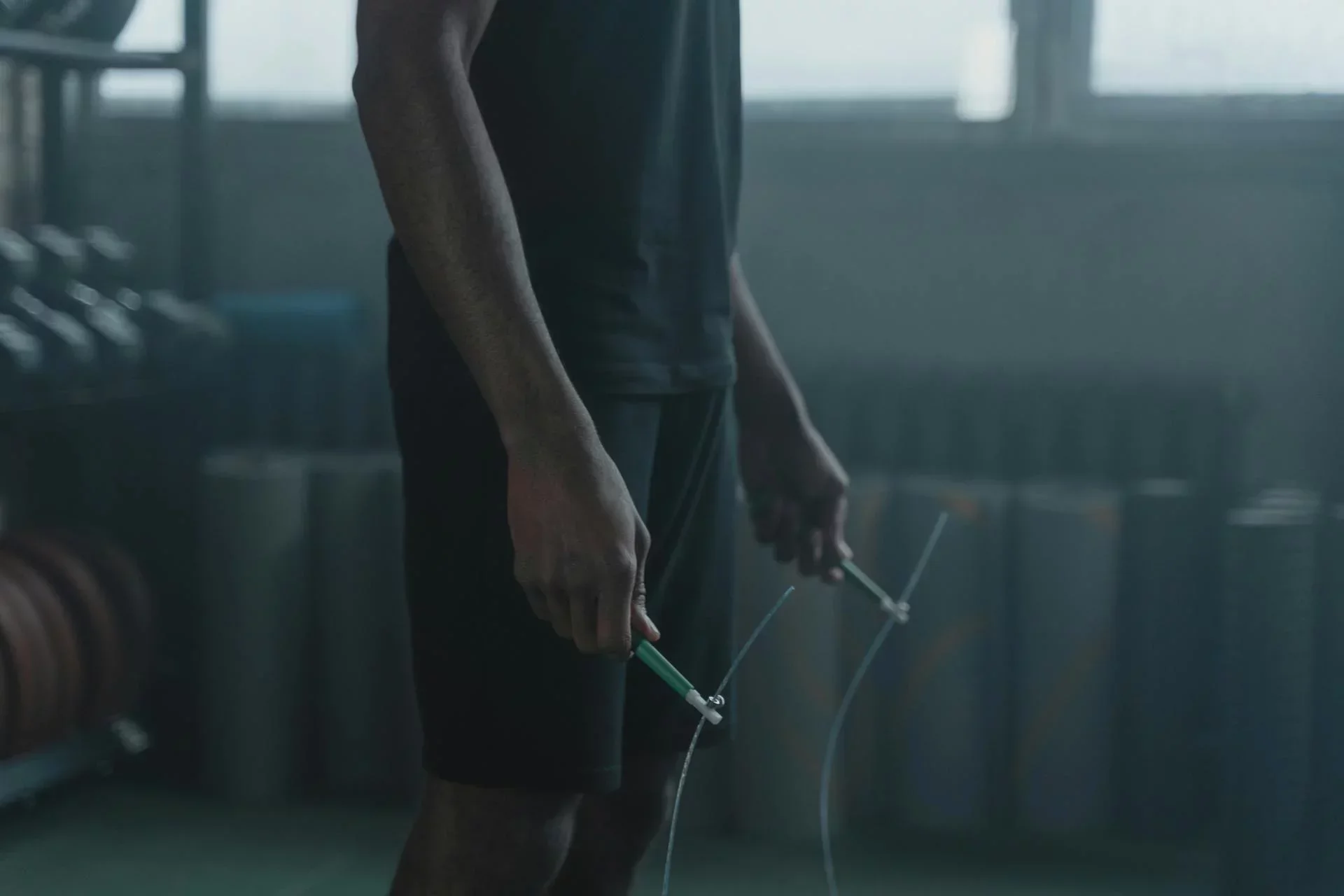 CrossFit gym member holding jump rope, representing CrossFit member management software