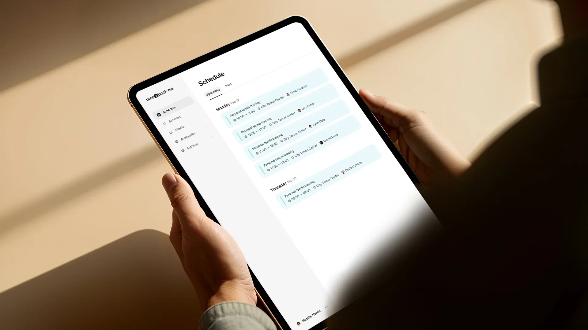 Tablet displaying a gym booking schedule using time2book, showing automated class scheduling and client management features